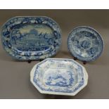 A 19th century blue and white meat dish printed with figures in the grounds of Hylands Essex crowned