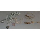 A small quantity of costume jewellery including a Tiffany & Co. white metal link necklace with heart