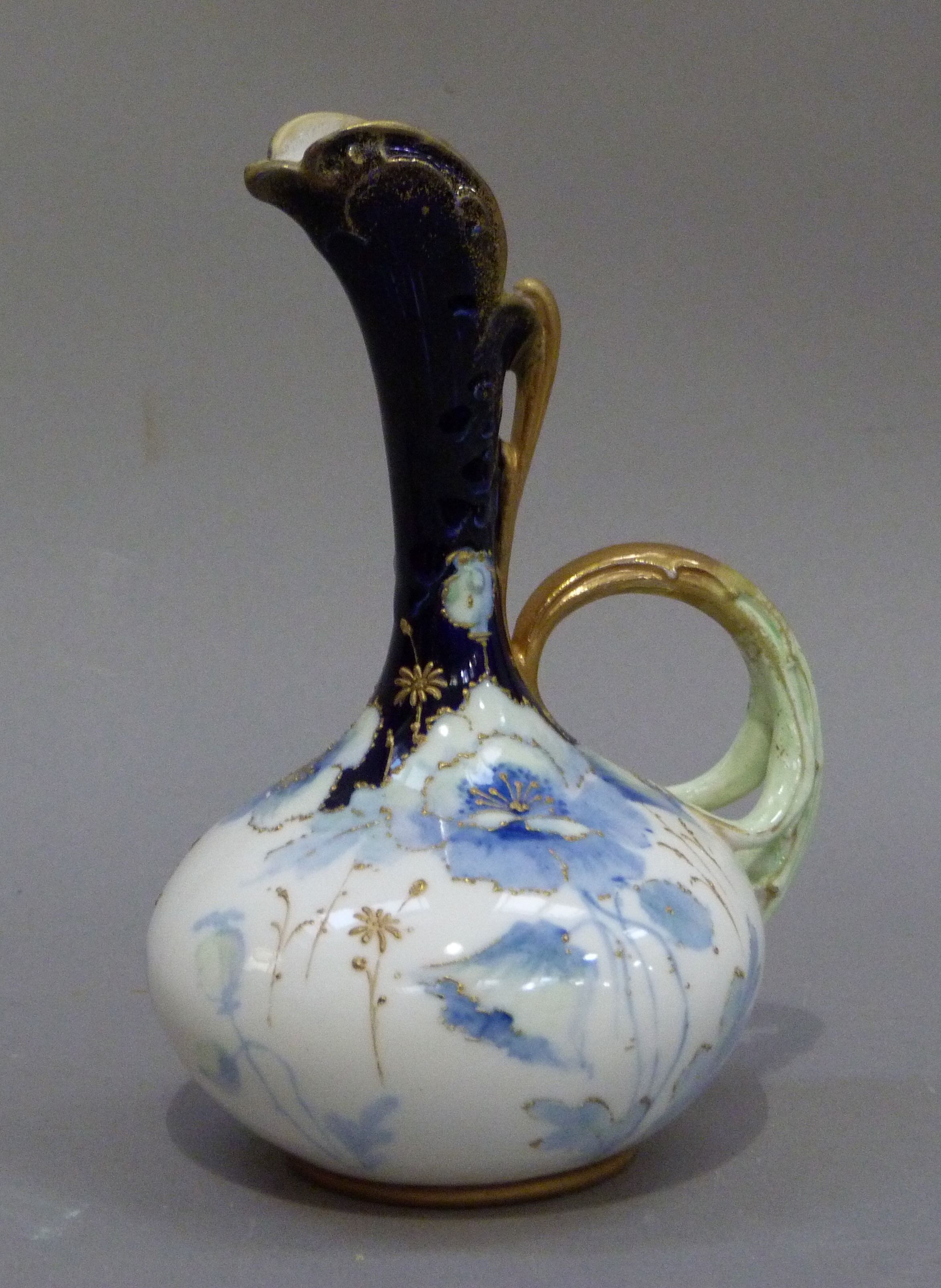 An Austrian china ewer decorated with blue poppies