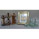 Three bobbin stands, various antique and vintage glass bottles and a Persian style watercolour