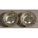 A pair of Victorian pierced and repousse decorated sweetmeat dishes, Sheffield 1898