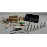 A quantity of cufflinks and studs, penknives, fruit knives, scissors, bobbins and a drawing set