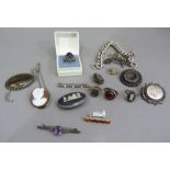 A collection of silver jewellery including brooches, rings, bracelets and a pendant, variously set