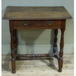 A 17th century style oak single drawer side table, the rectangular top with moulded lip above drawer