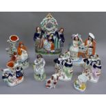 A group of Staffordshire pottery including figure groups Scotsman and his Lass, Red Riding Hood with