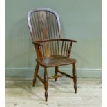 A late 19th century ash and elm high back Windsor elbow chair with pierced splat, bordered seat on