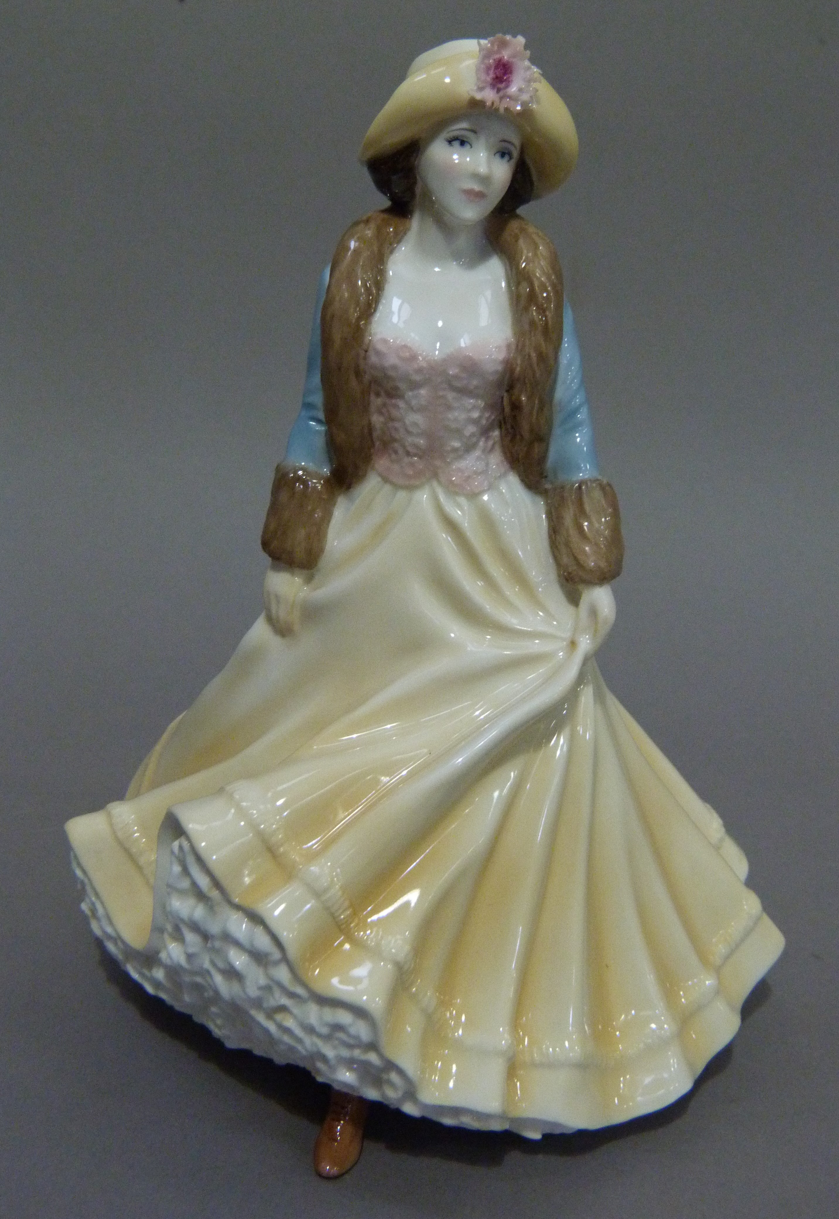 A Royal Worcester figure Ladies Day from The High Society series, 22cm high, boxed