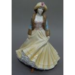 A Royal Worcester figure Ladies Day from The High Society series, 22cm high, boxed