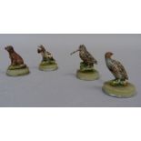 A set of four hunting and shooting themed cold painted and onyx name markers in the form of