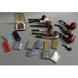 A collection of lighters including, Ronson, Calibre, and a selection of pipes