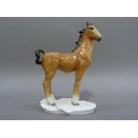 A Volkstedt porcelain figure of a foal on white moulded base, 20cm high, printed mark in green