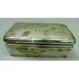 A silver cigarette box, Birmingham 1902, 19.5cm wide x 11cm deep x 6.5cm high