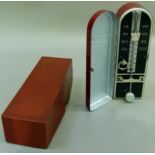 A vintage German Taktelly metronome in maroon metal case and in original box