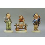 Three Hummel figures, home from market, girl sitting on a fence and young man singing from a song