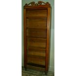 A set of 19th century oak open book shelves on turned feet