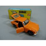 A Corgi MGC GT competition model die cast car, orange livery, boxed