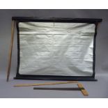 A silvered projection screen, wooden T square and a wooden rule 36 inch/1 meter
