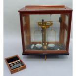 A set of high quality chemist's scales with brass lacquered cylindrical post and beam, numbered