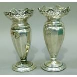 A pair of silver vases with pierced rims on circular foot (at fault) Birmingham 1918,