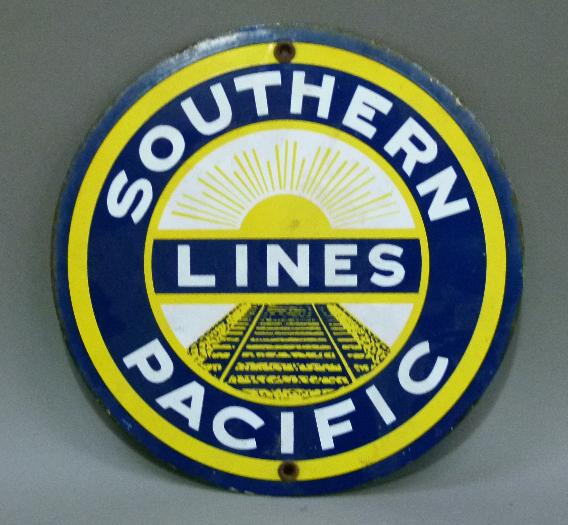 A circular enamel sign: Southern Pacific Lines, 22cm diameter