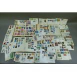 Three world stamp albums, mixed, mainly hinged and mounted, approximately sixty GB EIIR pre-