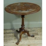 A Victorian burr walnut veneered tripod table, the inlaid oval top on a fluted turned column and