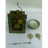 A clock movement the back plate marked W Francis Birmingham complete with bell and pulleys for the