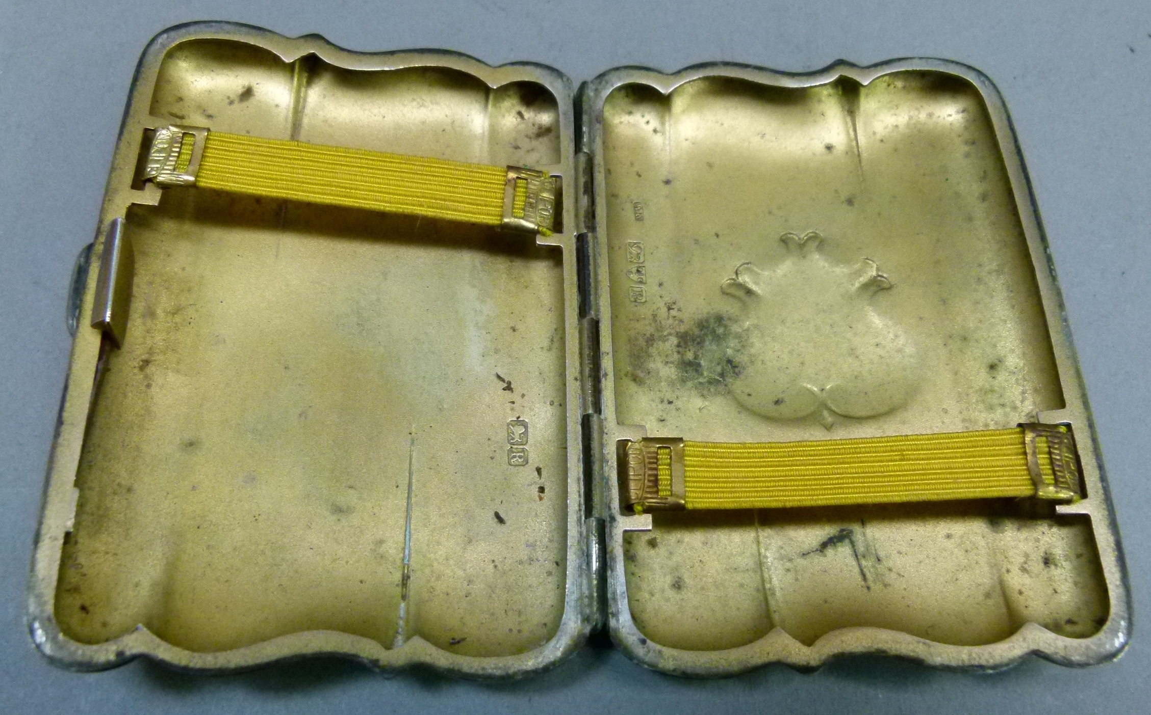 A silver cigarette or cheroot case of bracketed outline engraved with a monogram to the cartouche, - Image 2 of 2