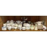 A Royal Doulton tumbling leaves tea service comprising tea pot, sugar, cream, six cups and six