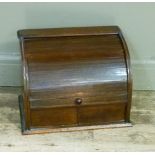 A late Victorian mahogany stationery cabinet having a tambour front the interior fitted with