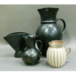 A large black Prinknash jug, 31cm high, a smaller jug, 15.5cm, a vase 16cm high, together with a