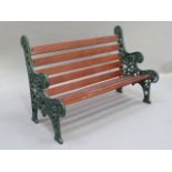 A miniature cast iron and wooden slatted garden bench, 40.5cm wide
