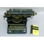 A Woodstock typewriter model eight 14inch with open basket keys, together with a Pitmans typewriting