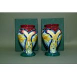 A pair of Old Tupton ware baluster vases tube lined and enamelled with daffodils, 10cm high, in