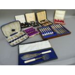 A cased set of six teaspoons and sugar tongs, cased set of EPNS cake forks and server, case of