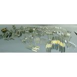 A quantity of mixed silver plated cutlery, souvenir spoons, marbled handled tea knives, various