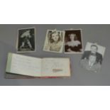 An autograph book containing a film studio photograph signed in biro by Patricia Roc, a photograph