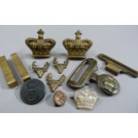 A small quantity of army badges, buckles, etc