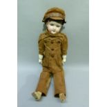 An Armand Marseille bisque headed boy soldier doll incised mark to the back of the neck Germany