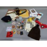 A collection of Girl Guide items including nine badges, six enamelled, 1953 coronation Girl Guide