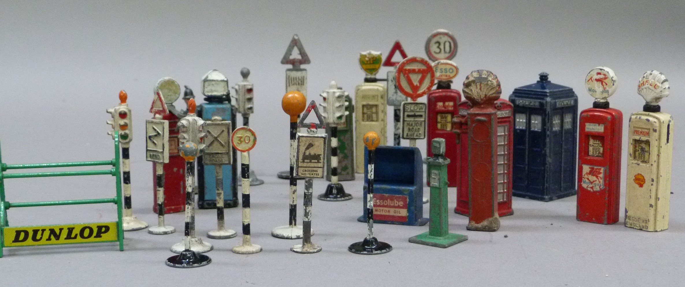 A quantity of Dinky petrol pumps, telephone and police box, road signs, traffic lights, etc,