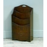 A 1930's oak waterfall magazine rack with finger grip