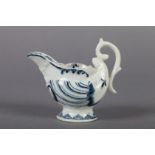A Derby blue and white porcelain butter boat c.1760 of moulded nautilus shape, the spout with
