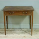 An early 19th century mahogany side table having a cockbeaded drawer to the apron with two brass