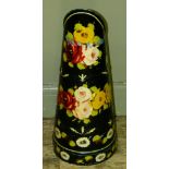 A bargeware style painted coal pod, the black ground painted with red and green flowers