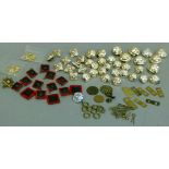 A small quantity of military badges, buttons etc by Gaunt, Firmin, Buttons Ltd Birmingham,