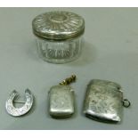 A Victorian silver lidded toiletry pot engraved with monograms, chip to the glass, London 1882;