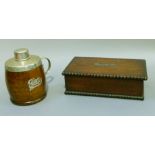 A silver plate mounted oak tea caddy of ovoid form, lettered for tea and with handle, 14cm high;