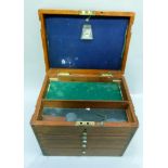 A 19th century mahogany chest with brass carrying handle the hinged lid revealing two compartments