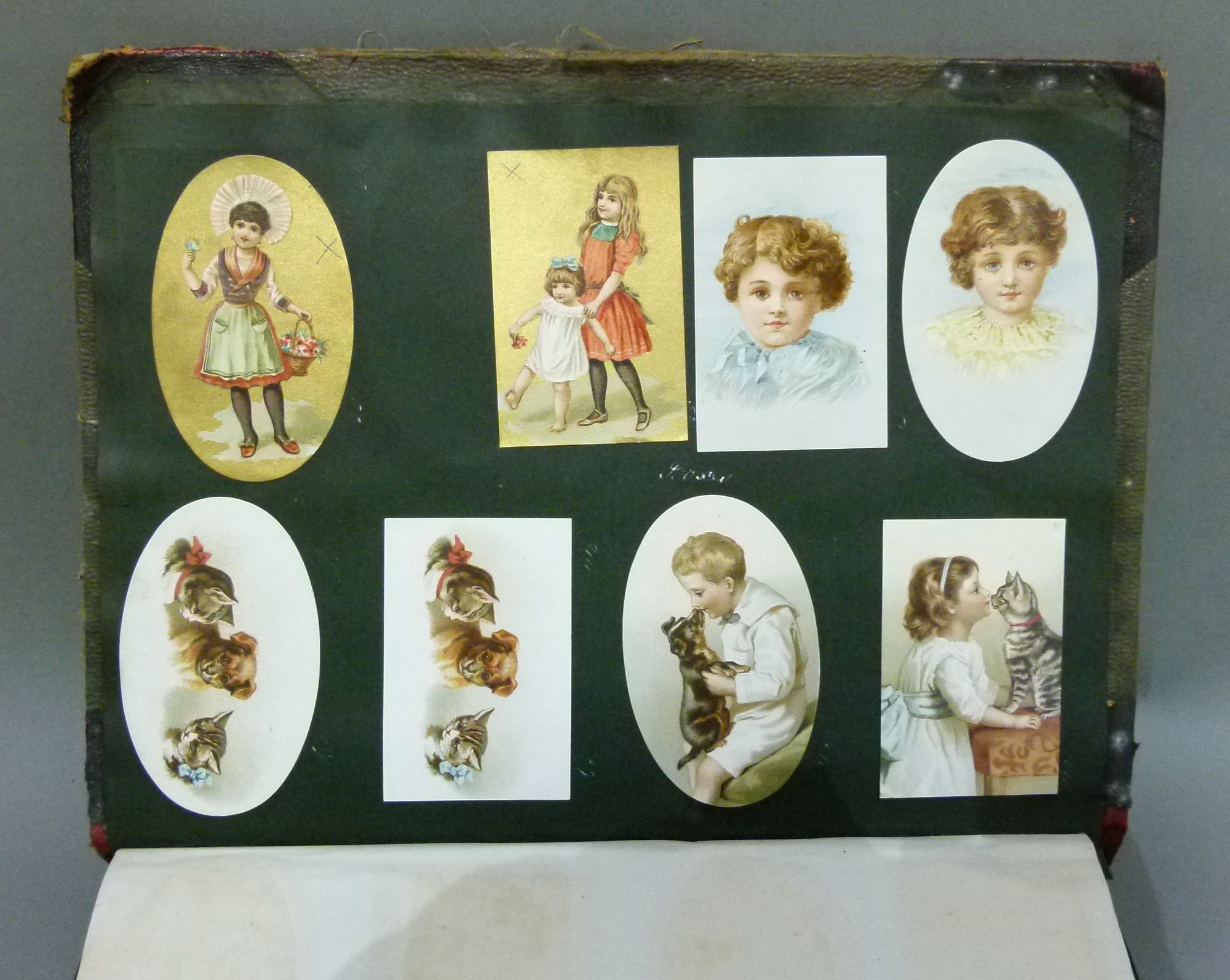 A Victorian scrap album oval and rectangular cards, various subject matters including cats, - Image 3 of 8